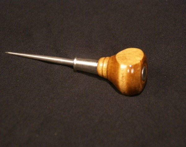 Wood awl handle with a pointed metal tip, designed for precision hand tools.